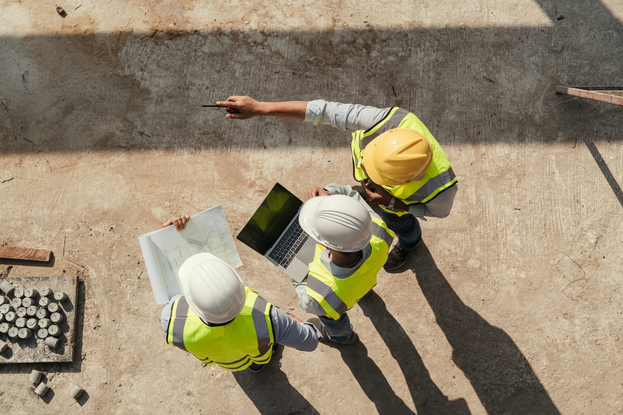 aerial view of health and safety inspectors on a building site