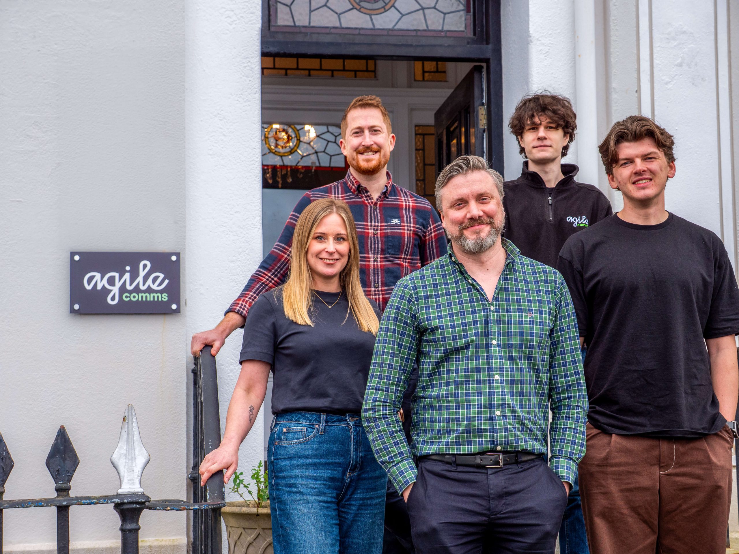 Agile Comms team picture outside office
