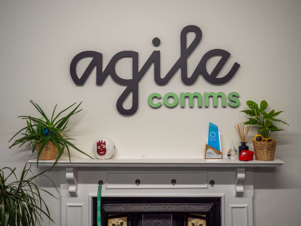 Agile Comms sign in their office